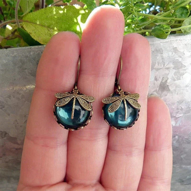 Antique Gold Dragonfly Earrings with a Spherical Design