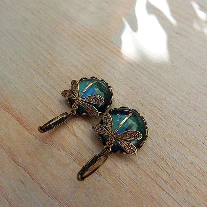 Antique Gold Dragonfly Earrings with a Spherical Design